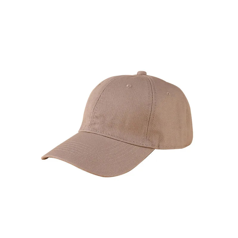 A beige classic cotton dad hat shown from the side.