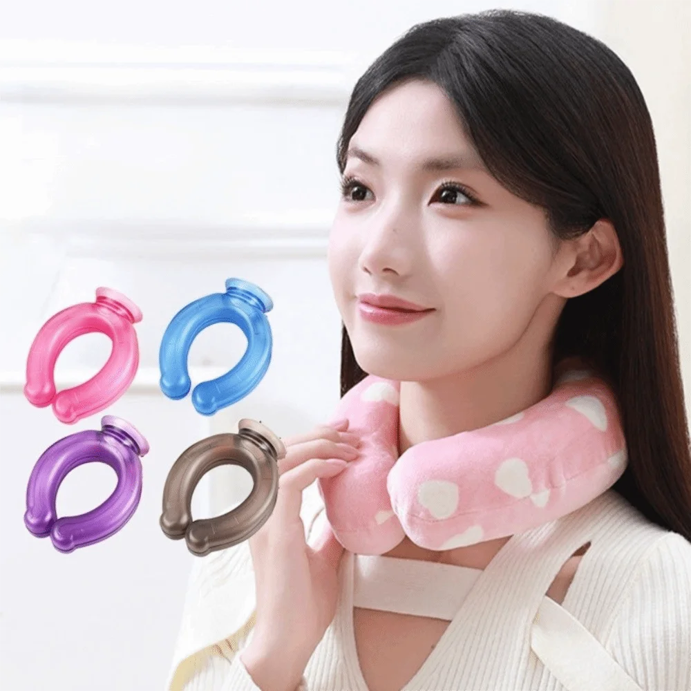 A woman holds various colored U-shaped reusable neck wraps, including pink, blue, purple, and gray, against her neck.