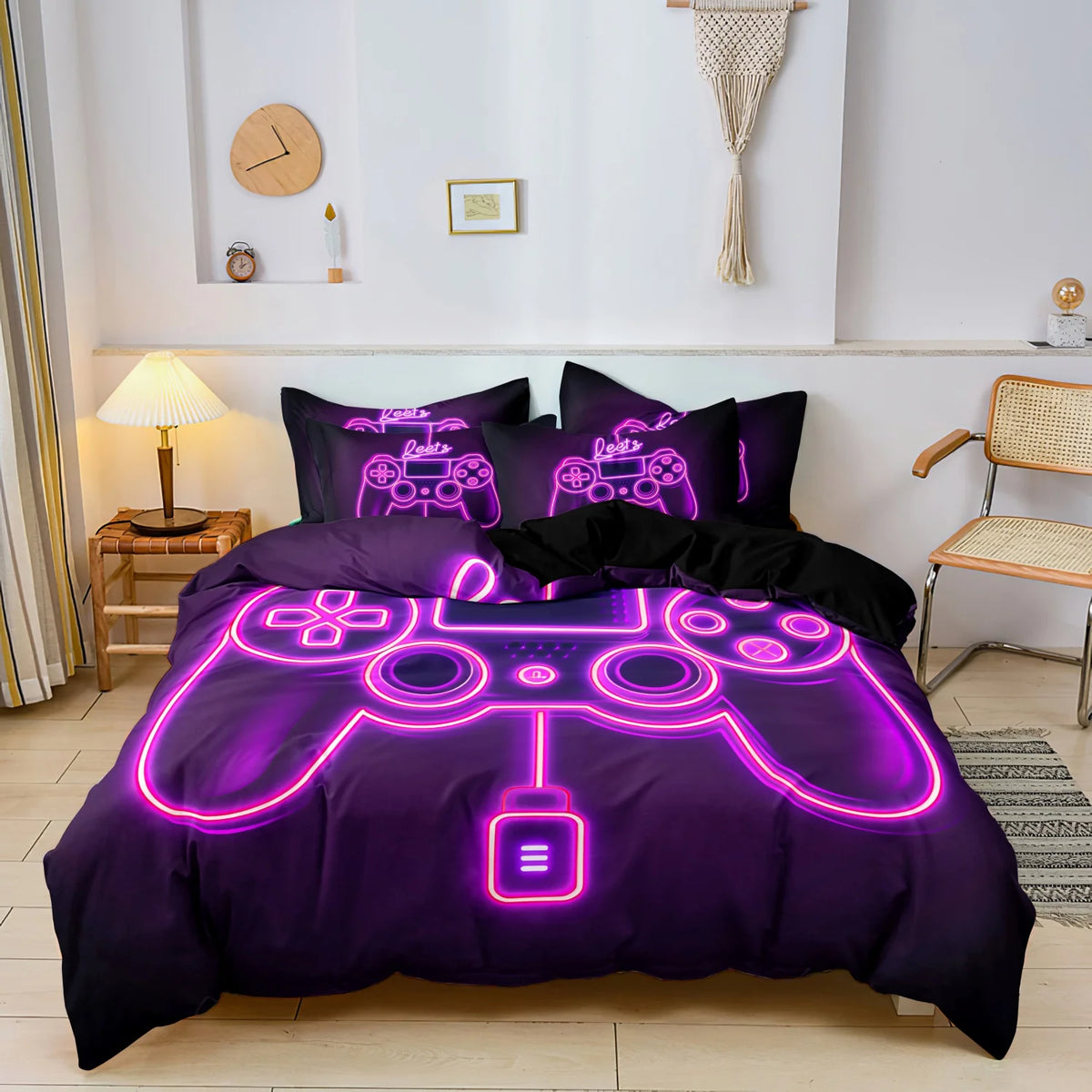 A purple duvet cover featuring a glowing neon outline of a video game controller and keyboard print.