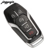A black Ford smart key replacement shell with various buttons and a silver blade is shown from above.