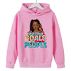 Pink hoodie featuring a graphic of a woman with glasses and hair, with the text Chasing Goals not People.