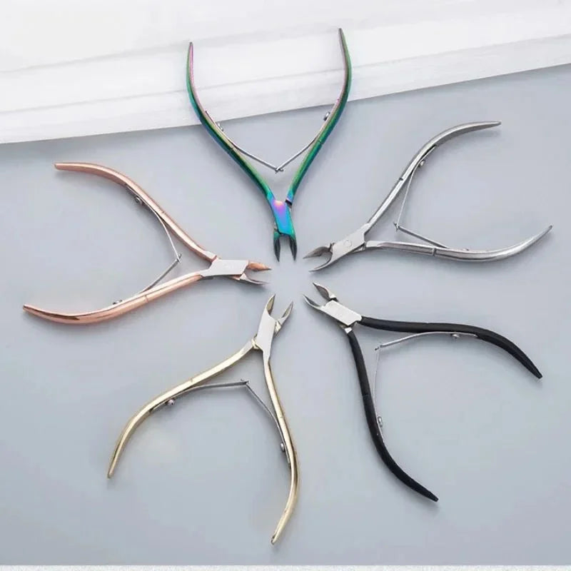 A collection of professional stainless steel cuticle nippers in various colors and angles.