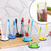 A collection of adjustable bag holder racks in various colors, including white, blue, black, red, and green, displayed on a w
