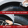 A hand pours liquid onto a tire, demonstrating the dirt-resistant and easy-to-clean properties of a tire restorer.