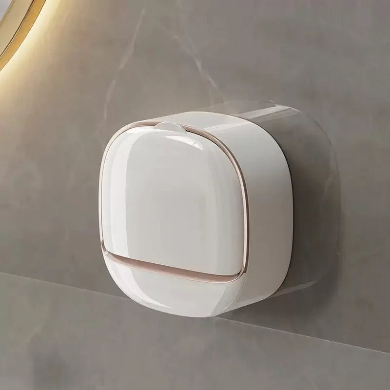 A white waterproof hanging soap holder with drainage is mounted on a gray wall.