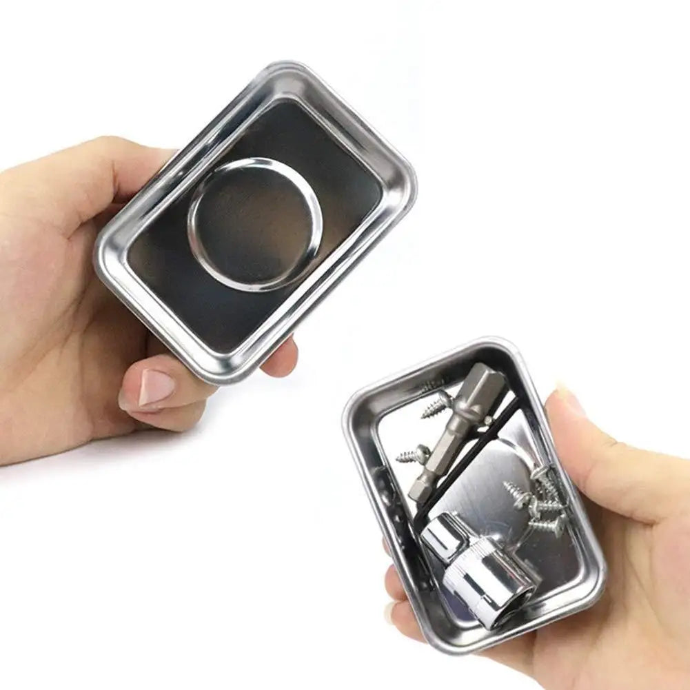 A hand holds a silver magnetic parts tray with a circular base for hardware storage.