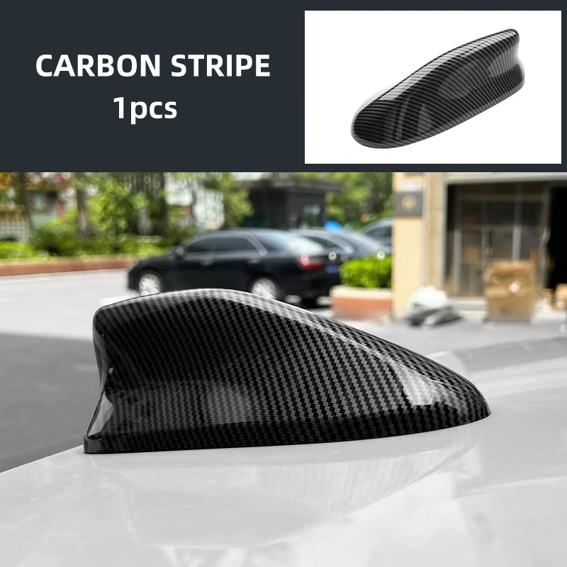 Black carbon stripe antenna cover for a car, shown in profile.