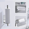 A stainless steel toilet paper holder with a roll of white paper towel displayed on a wall.
