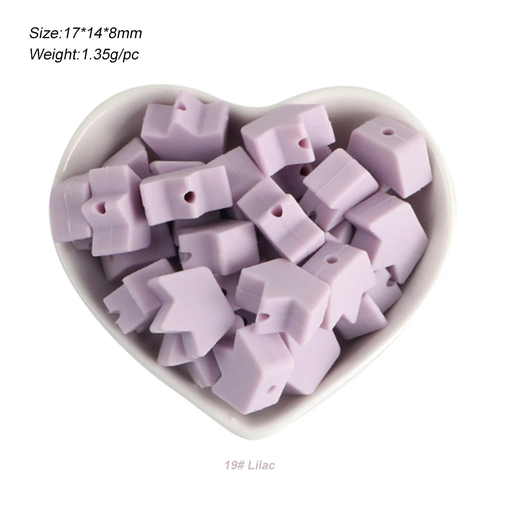 A pile of 19 lilac silicone crown star heart beads for DIY jewelry making