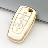 A white and gold TPU car key fob cover case with buttons for volume, power, and lock functions.