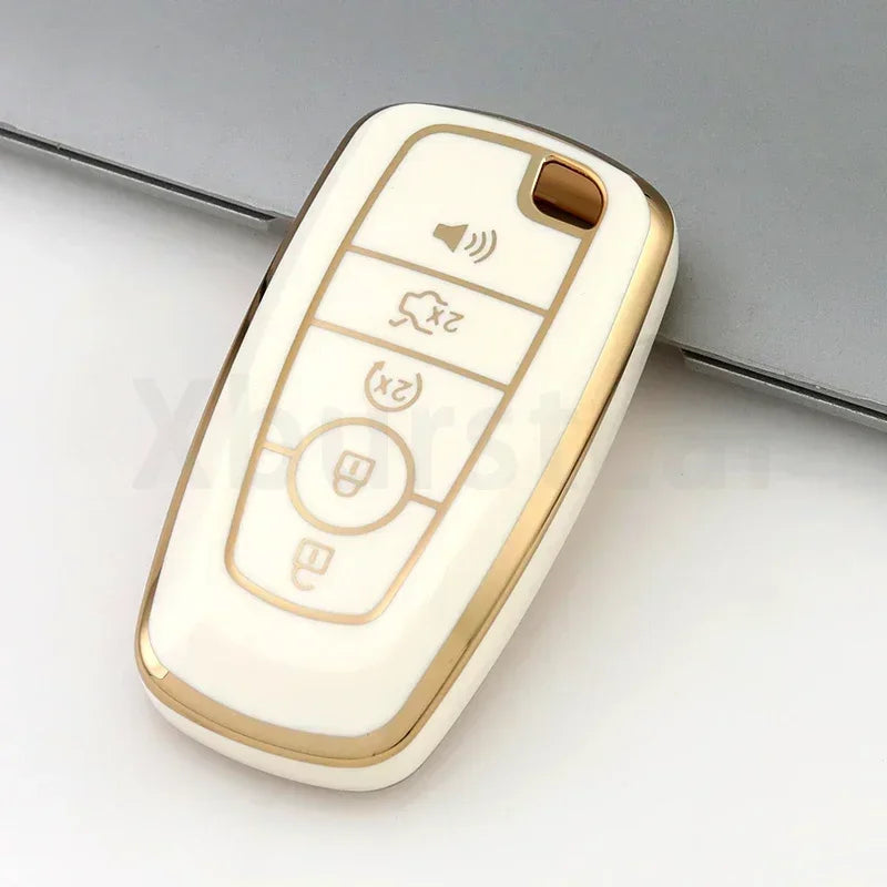 A white and gold TPU car key fob cover case with buttons for volume, power, and lock functions.