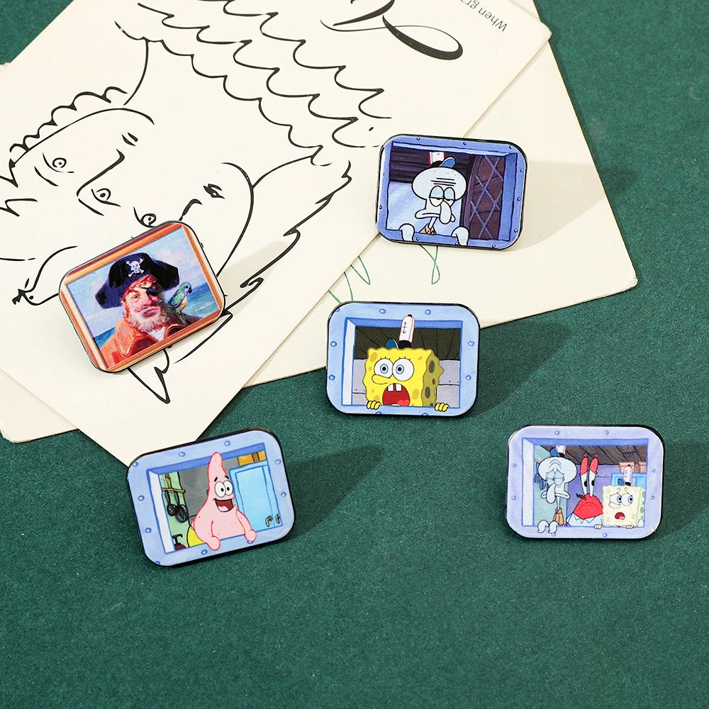 A collection of enamel pins featuring characters from SpongeBob SquarePants and Captain Patrick Star displayed on a green sur