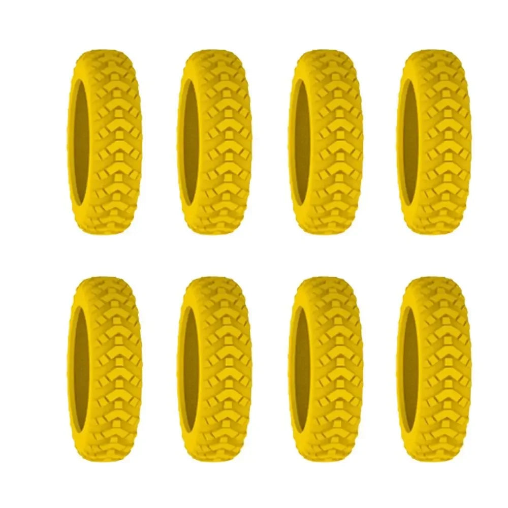 A set of yellow silicone luggage wheel protectors for quiet and scratch-free travel.