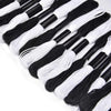 A collection of 24 embroidery floss spools in alternating white and black colors.