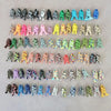 A collection of multi-colored paracord ropes arranged in rows for outdoor, camping, and DIY use.