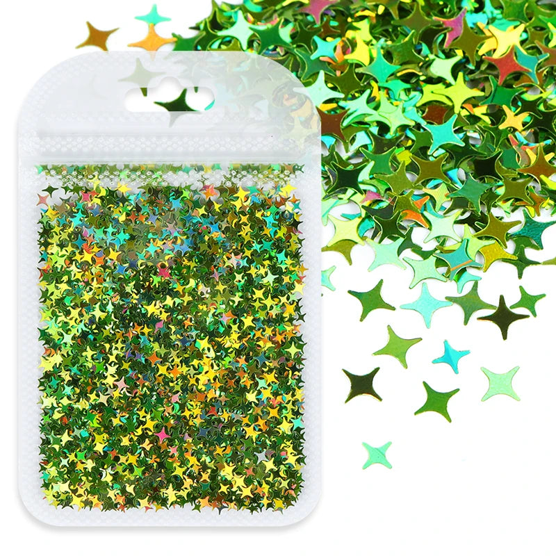 A clear plastic container filled with green and gold holographic star sequins for resin crafts.