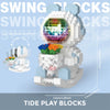 A white astronaut figure made of Tide Play Blocks with a glowing, colorful interior and an LED light.