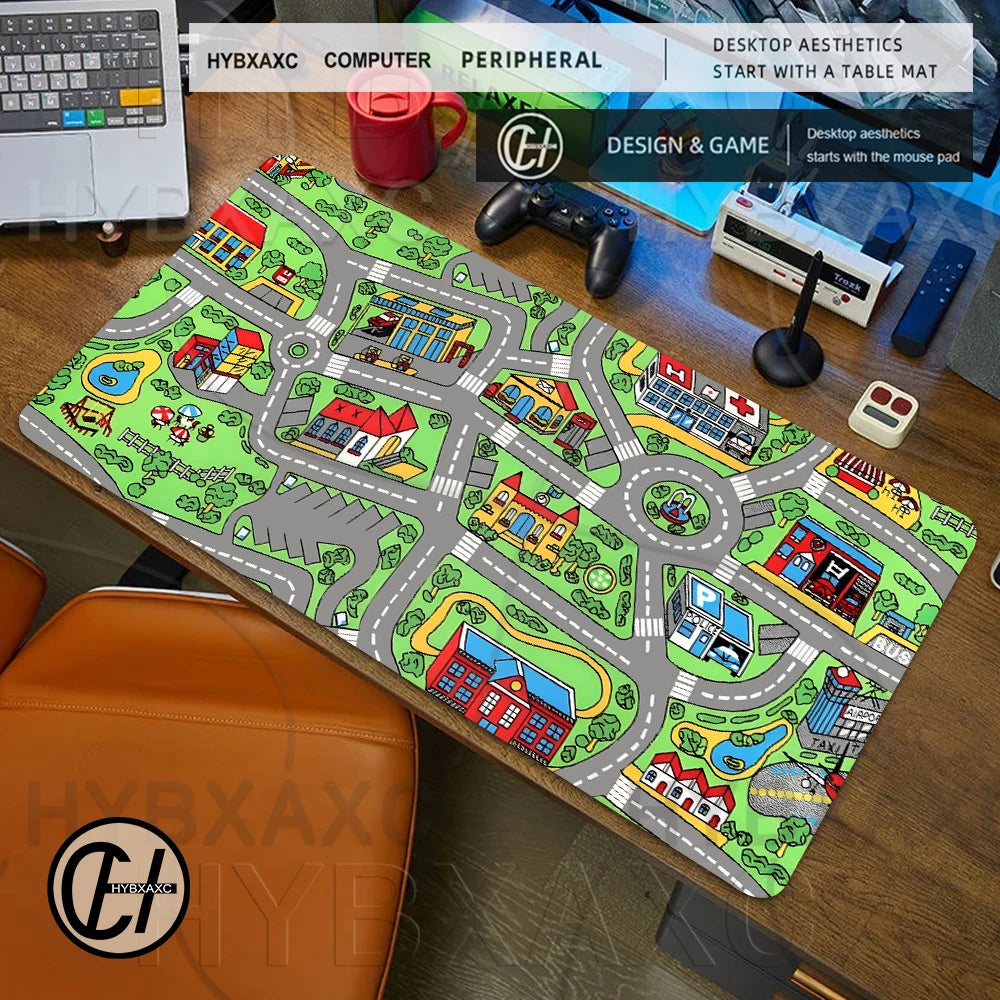 A large gaming mouse pad featuring a vintage city road design with houses and buildings on a wooden desk.