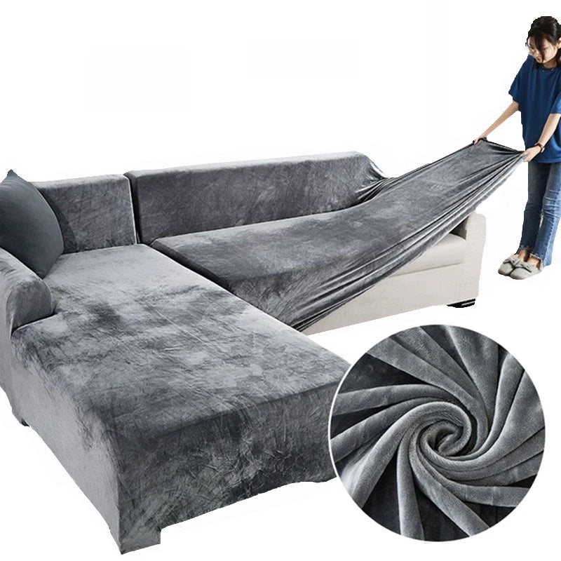 Gray plush velvet elastic sofa cover draped over an L-shaped sofa and a section of a standard sofa.