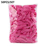 A bag of 50 pink disposable transparent waterproof shower caps