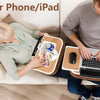 A person is using a pillow stand for a phone or iPad, which functions as a lap desk.