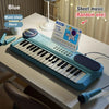 A blue 37-key electronic piano is displayed on a table next to music sheets and a microphone.