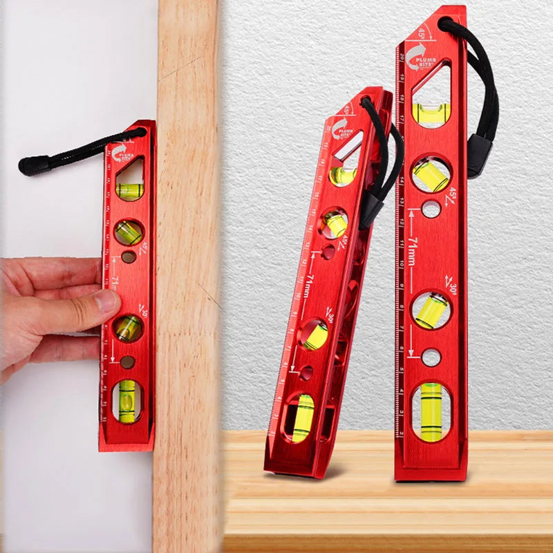 A red magnetic aluminum level ruler with V-groove for precise angle measurement is shown next to a wooden surface.
