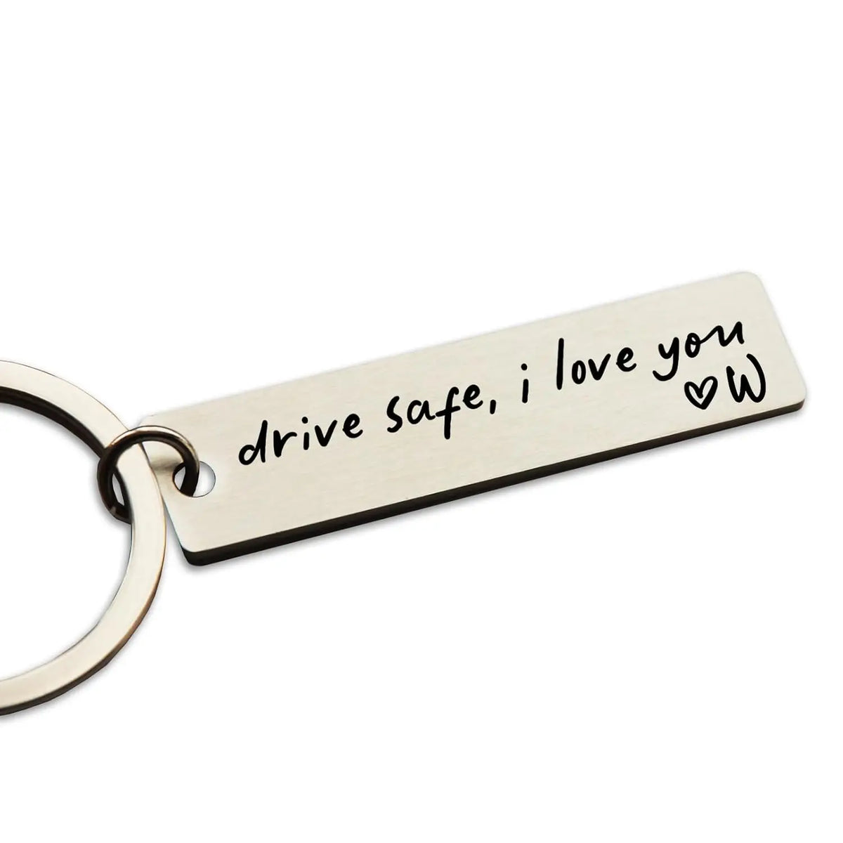 A personalized stainless steel keychain engraved with the message drive safe i love you and a heart symbol.