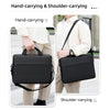 Demonstration of a black waterproof nylon laptop sleeve being carried by hand and over the shoulder.