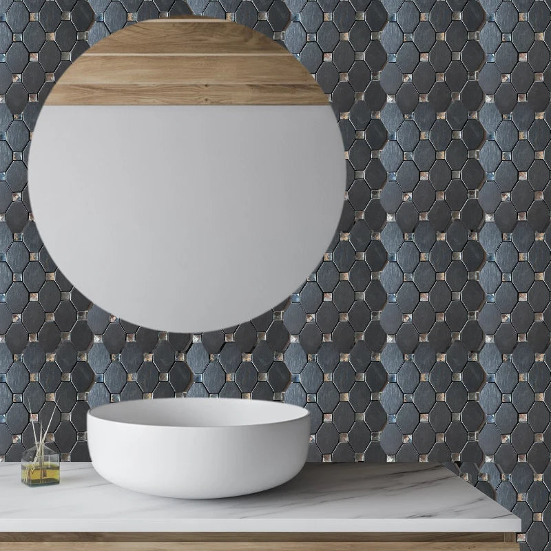 A white bowl sits on a light marble countertop against a dark mosaic tile wall.