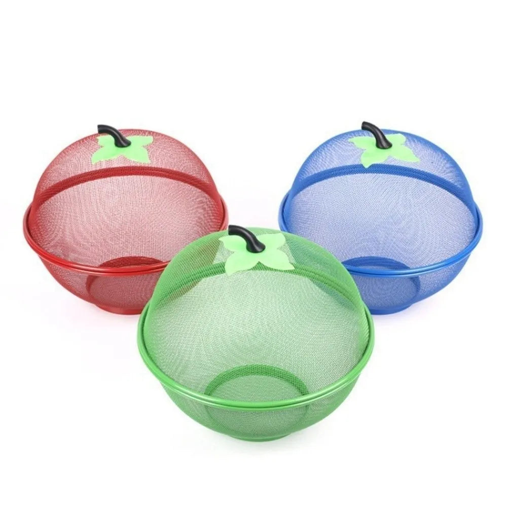 Three metal fruit baskets with mesh covers in red, blue, and green.