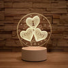 A glowing wireframe heart sign featuring the words I LOVE YOU displayed on a round light fixture.
