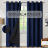 Dark blue blackout curtain panel hanging in a window frame.