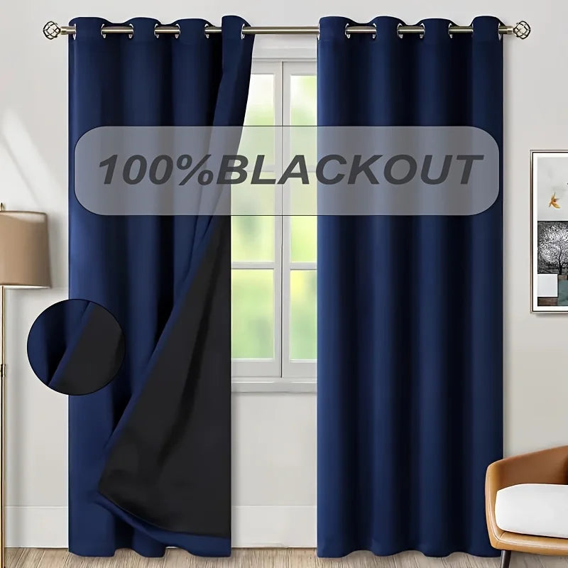 Dark blue blackout curtain panel hanging in a window frame.