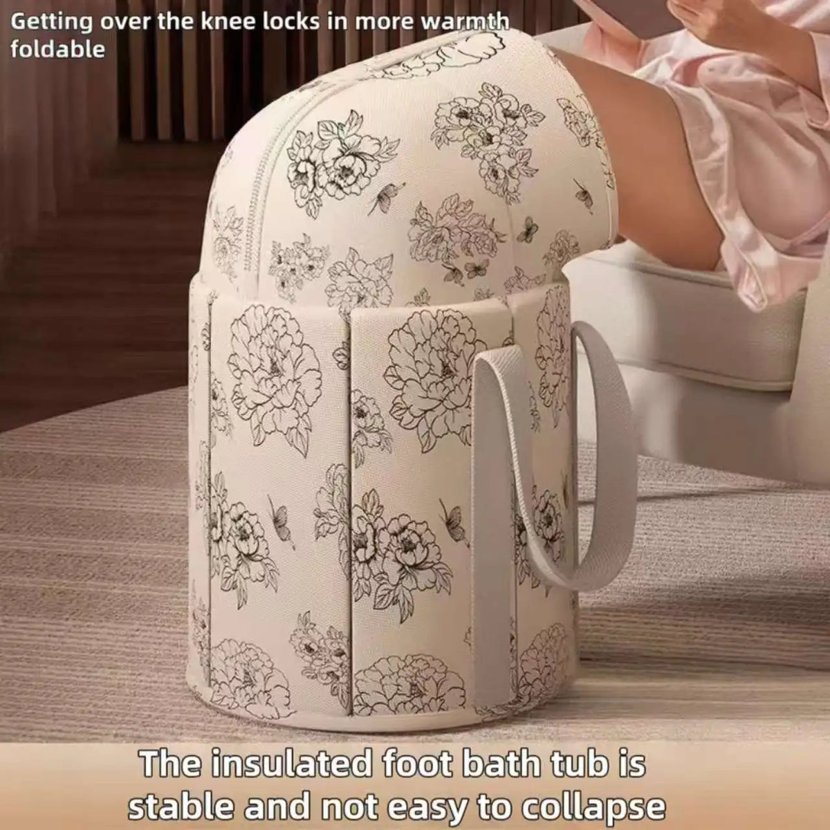 A white foldable calf-height foot soaking tub is shown on a surface, with a hand resting near it.