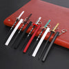 A collection of nine miniature replica swords inspired by Demon Slayer, featuring various blade colors and metal fittings.