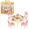 A boxed set of Sylvanian Families Forest Friends featuring pink furniture and small figures.