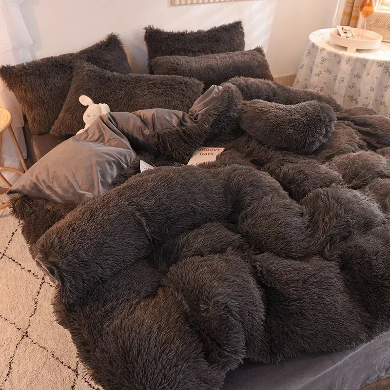 A dark gray plush mink velvet duvet cover set with matching sheets and pillows.