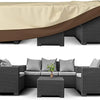 A waterproof patio furniture cover shown draped over a dark brown wicker outdoor sofa set.