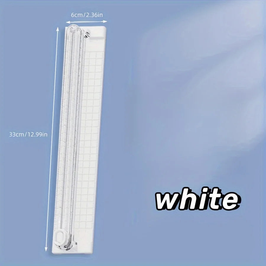A white portable paper cutter trimmer with a 33cm length and 6cm blade shown vertically.