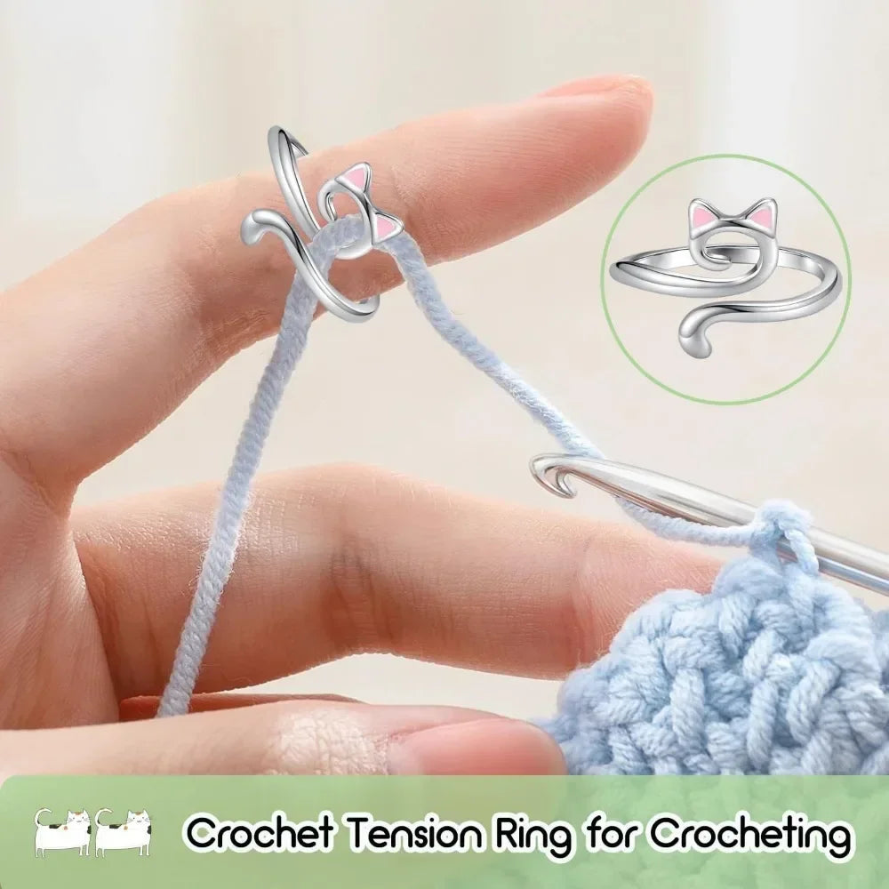 A hand holds a light blue crochet tension ring for crocheting next to a finished yarn piece.