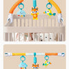 A baby stroller arch toy featuring orange and white arms with hanging plush charms of a blue cloud, an orange fox, and a yell