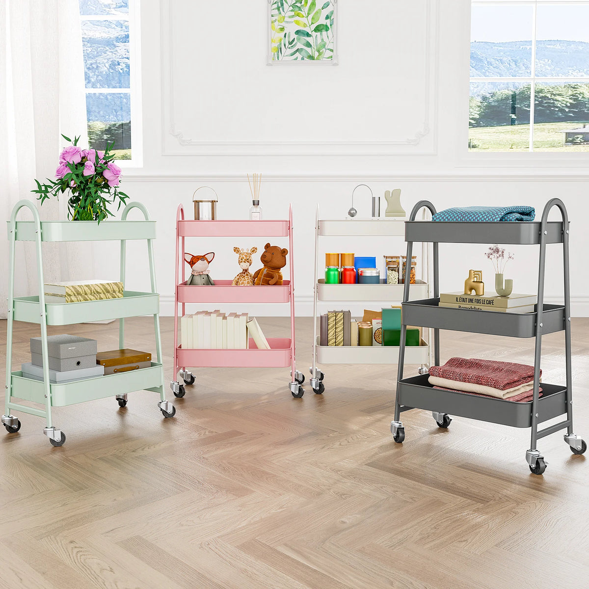 A pink and gray 3-tier rolling metal storage cart with lockable wheels holding various books and decorative items.