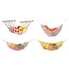Three macrame hanging fruit hammocks made of woven material holding various colorful fruits.