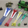 A set of four stainless steel bias tape makers with different sized metal clips and colored tapes.