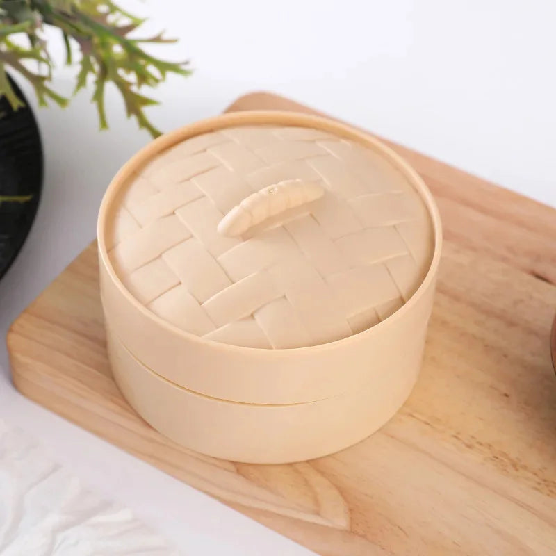A light beige squishy stress relief toy set in a round container resting on a wooden cutting board.