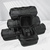 A stack of black portable leather watch travel cases with soft lining displayed on a white marble surface.