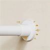A white adjustable tension shower curtain rod is mounted on a wall, showing its installation mechanism.
