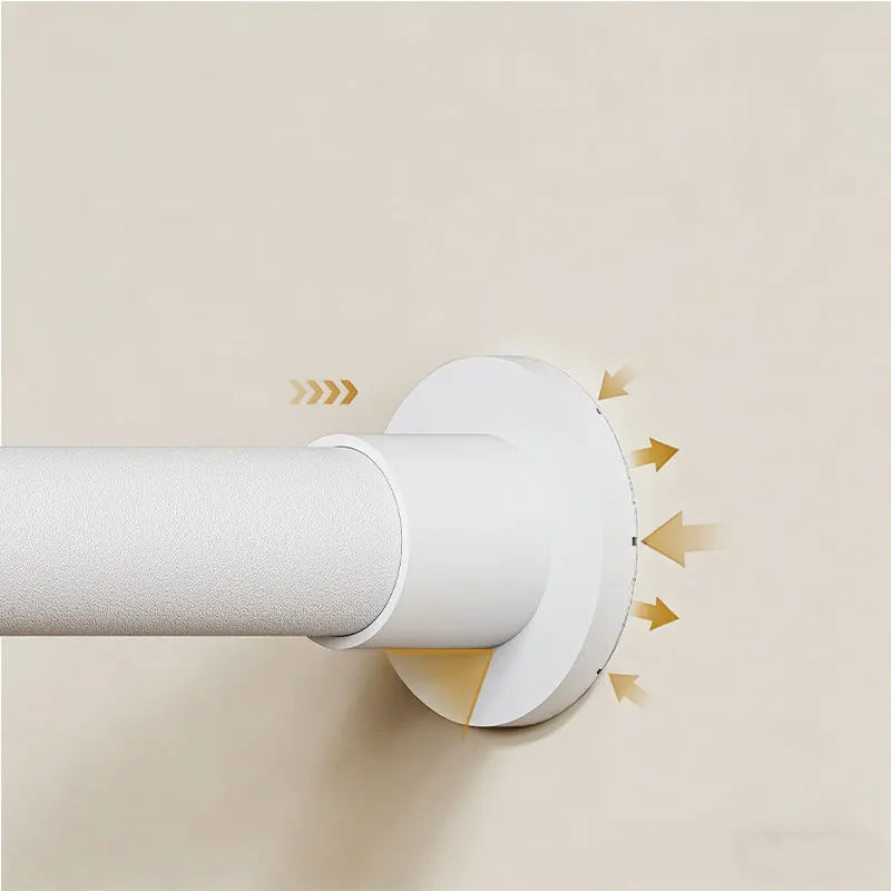 A white adjustable tension shower curtain rod is mounted on a wall, showing its installation mechanism.