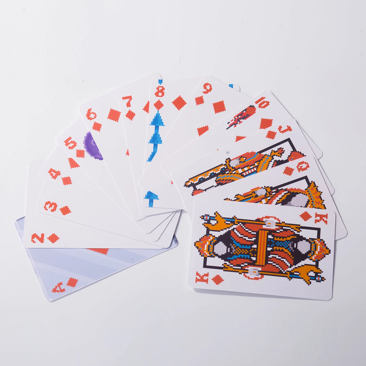 A fan of classic poker playing cards showing a spread of cards from 2 through King.